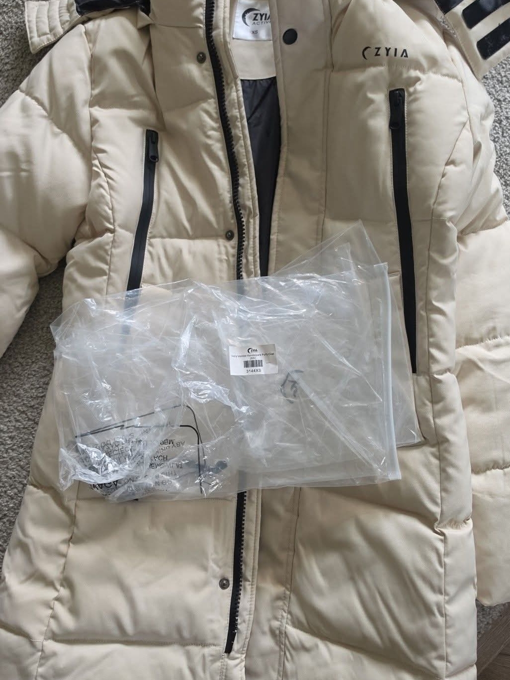 ZYIA Cream Puffer Coat with Black Trim Accents